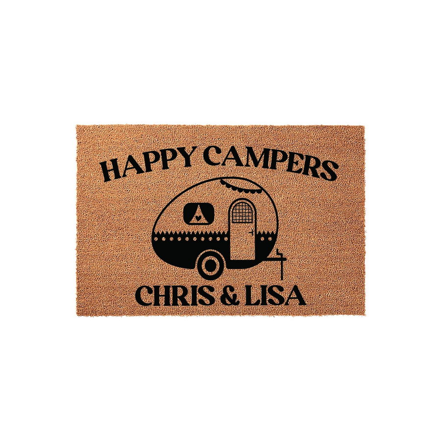 Personalized Happy Campers doormat featuring a black graphic of a vintage travel trailer on a natural coir background, with space for custom names printed in bold black lettering to welcome guests to your campsite or home