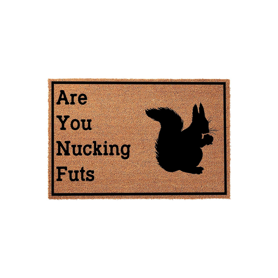 Funny Squirrel Welcome Doormat featuring a natural coir texture and a black silhouette of a squirrel eating a nut, with the humorous text Are You Nucking Futs printed in bold black lettering inside a simple rectangular border on