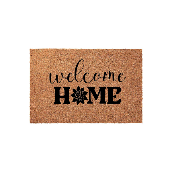 Welcome Home coir doormat featuring a natural brown fiber texture and bold black lettering, with a stylized floral icon replacing the letter O in the word home to create a charming and inviting entryway decor piece for your front
