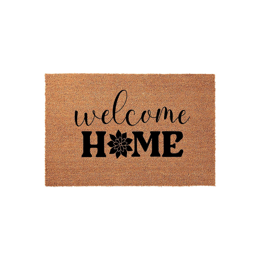 Welcome Home coir doormat featuring a natural brown fiber texture and bold black lettering, with a stylized floral icon replacing the letter O in the word home to create a charming and inviting entryway decor piece for your front