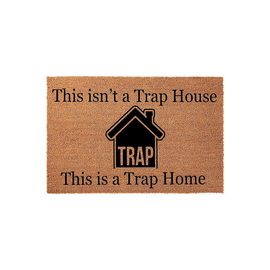 Funny Trap Home Doormat featuring a natural coir texture with black text that reads This isn't a Trap House, This is a Trap Home, centered around a bold house icon on a clean white background for a modern entryway decor statement.