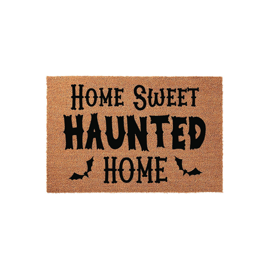 Home Sweet Haunted Home Halloween doormat made of natural coir fibers, featuring bold black text and small bat silhouettes printed on a rectangular mat against a clean white background for a festive seasonal entryway decor.