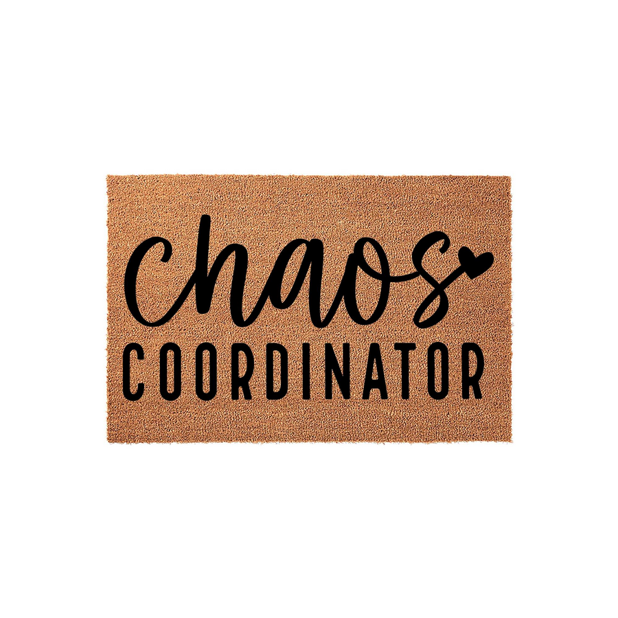 Chaos Coordinator coir doormat featuring a natural brown fiber texture with bold black lettering that reads chaos coordinator in a mix of script and sans-serif fonts, set against a clean white studio background for a modern home