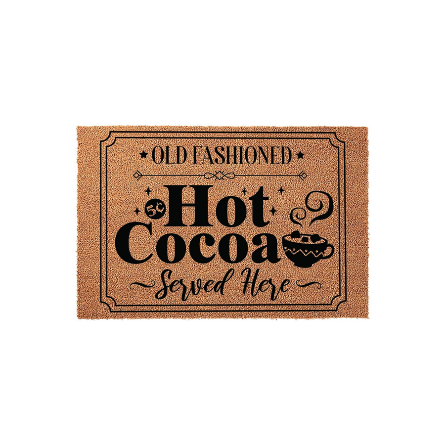 Old Fashioned Hot Cocoa Served Here coir doormat featuring a festive winter design with a mug of cocoa and marshmallows, printed in black ink on a natural brown textured fiber background for a cozy holiday entryway decor style.