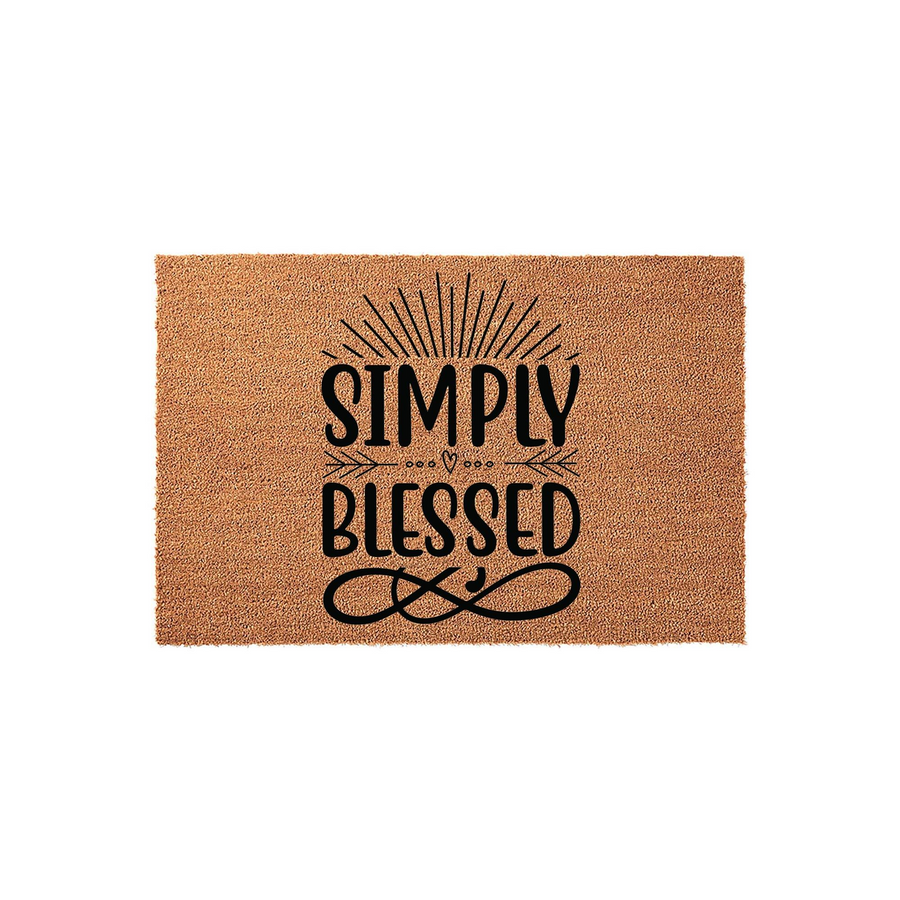 Simply Blessed coir doormat featuring a natural tan fiber texture with black printed text, a sunburst graphic, and an infinity symbol, creating a welcoming farmhouse style entrance for your home front porch or entryway floor