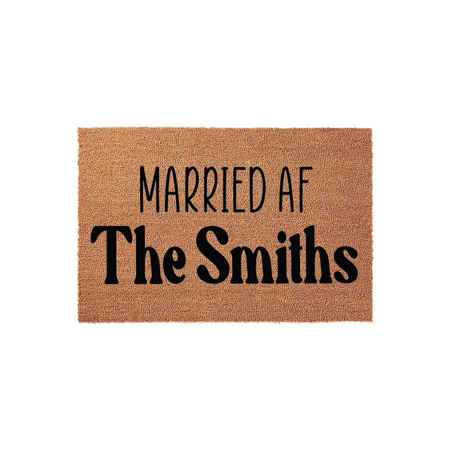 Personalized Married AF doormat featuring a natural coir texture and bold black lettering that displays the phrase Married AF followed by a custom family name, making it a fun and durable welcome mat for a newlywed couple's home.