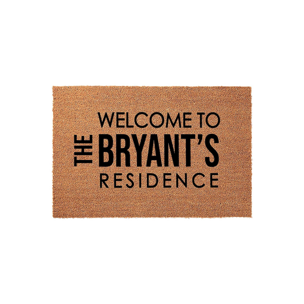Personalized family name coir doormat featuring a natural brown fiber texture and bold black text that reads Welcome to the Bryant's Residence, making a durable and welcoming entrance piece for any front porch or home entryway.