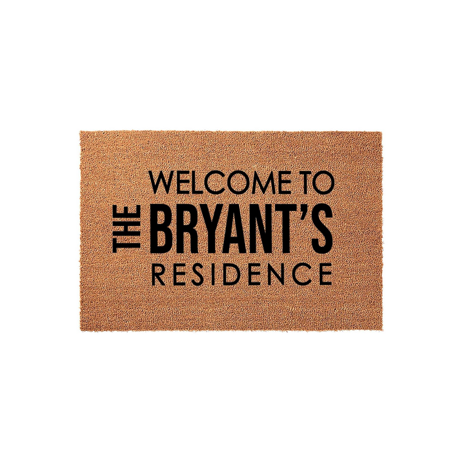 Personalized family name coir doormat featuring a natural brown fiber texture and bold black text that reads Welcome to the Bryant's Residence, making a durable and welcoming entrance piece for any front porch or home entryway.