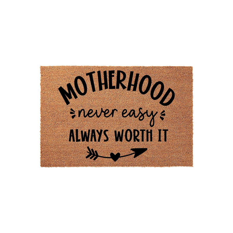 Motherhood Never Easy Always Worth It coir doormat featuring bold black typography and a decorative arrow with a heart icon, set against a natural tan fiber background for a rustic and welcoming front porch entryway decor style.