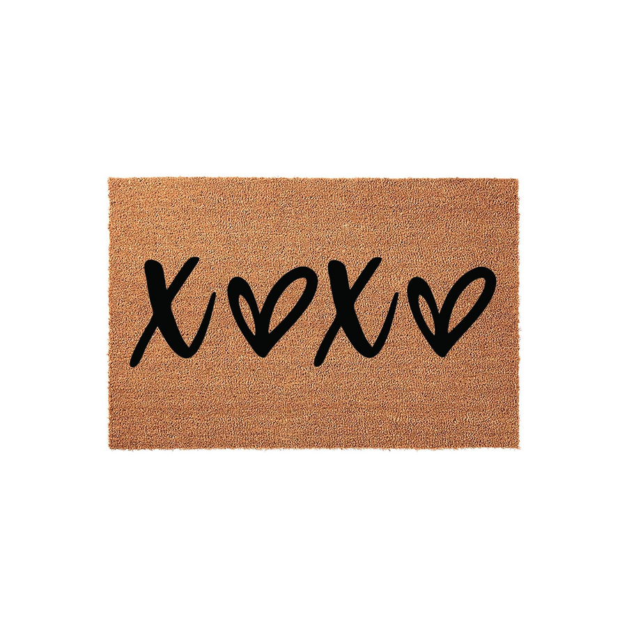 XOXO Coir Doormat featuring a natural brown fiber texture and bold black hand-lettered text that reads XOXO with heart shapes, creating a charming and welcoming entryway accent for your home decor on a clean white background.
