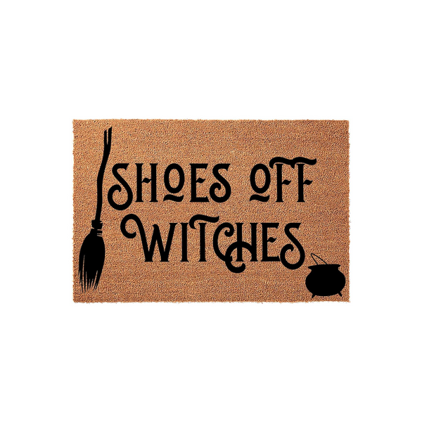Shoes Off Witches Halloween doormat featuring a natural coir texture with black printed text, a broomstick icon on the left, and a small cauldron graphic on the right for a fun, spooky entryway decor piece for the fall season.