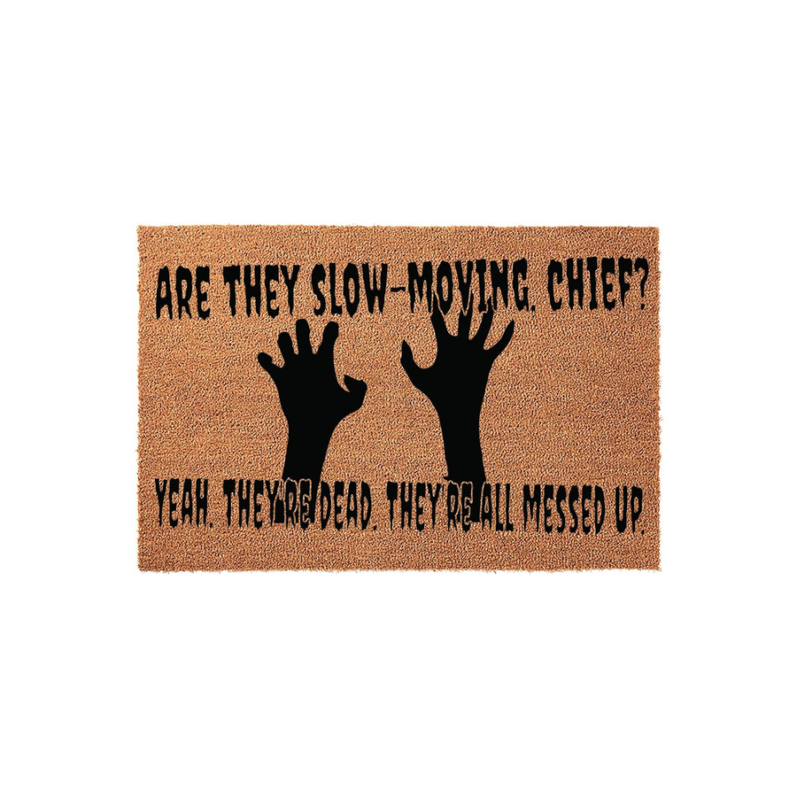 Funny Zombie Themed Coir Doormat featuring black silhouette hand prints and the text Are They Slow-Moving Chief? Yeah, They Are Dead, They Are All Messed Up, set against a natural brown textured fiber background for a spooky home