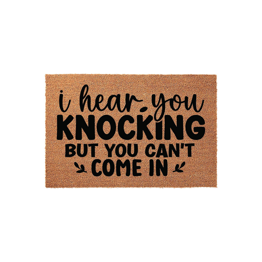 Funny I Hear You Knocking But You Can't Come In coir doormat featuring bold black typography on a natural brown fiber background, creating a humorous and welcoming entrance decor piece for your front porch or home entryway.