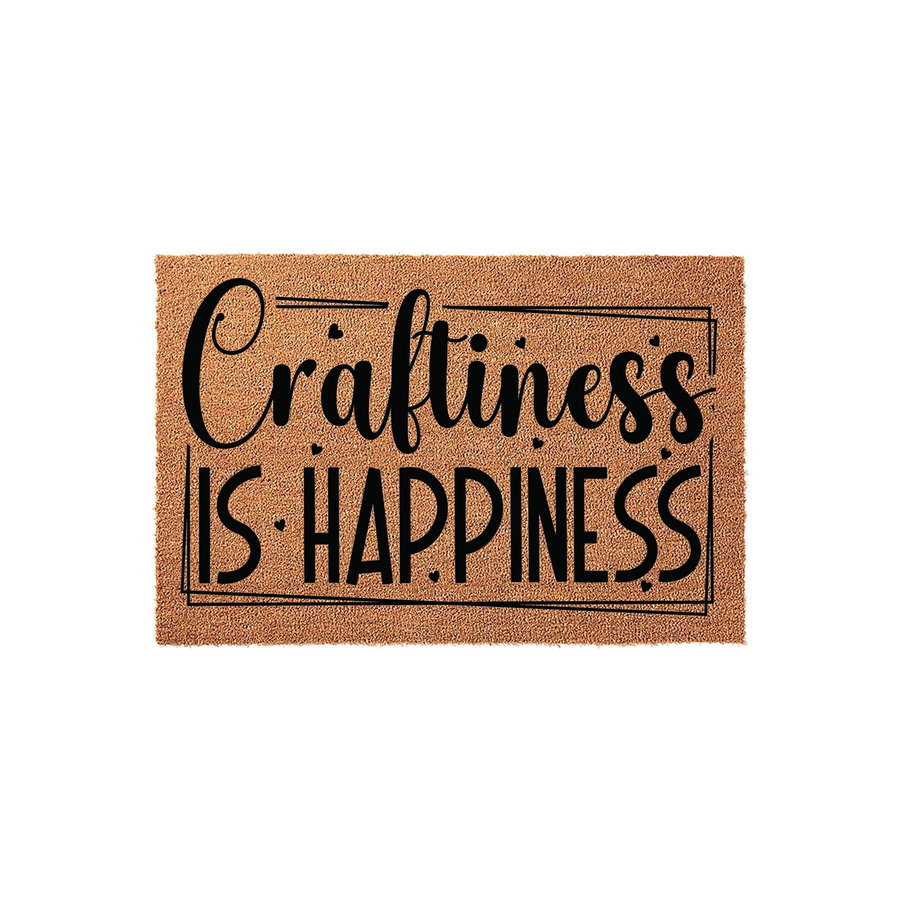 Craftiness Is Happiness coir doormat featuring a natural brown fiber texture and bold black typography enclosed in a simple rectangular border, creating a welcoming and creative entryway accent for any craft room or home entrance.