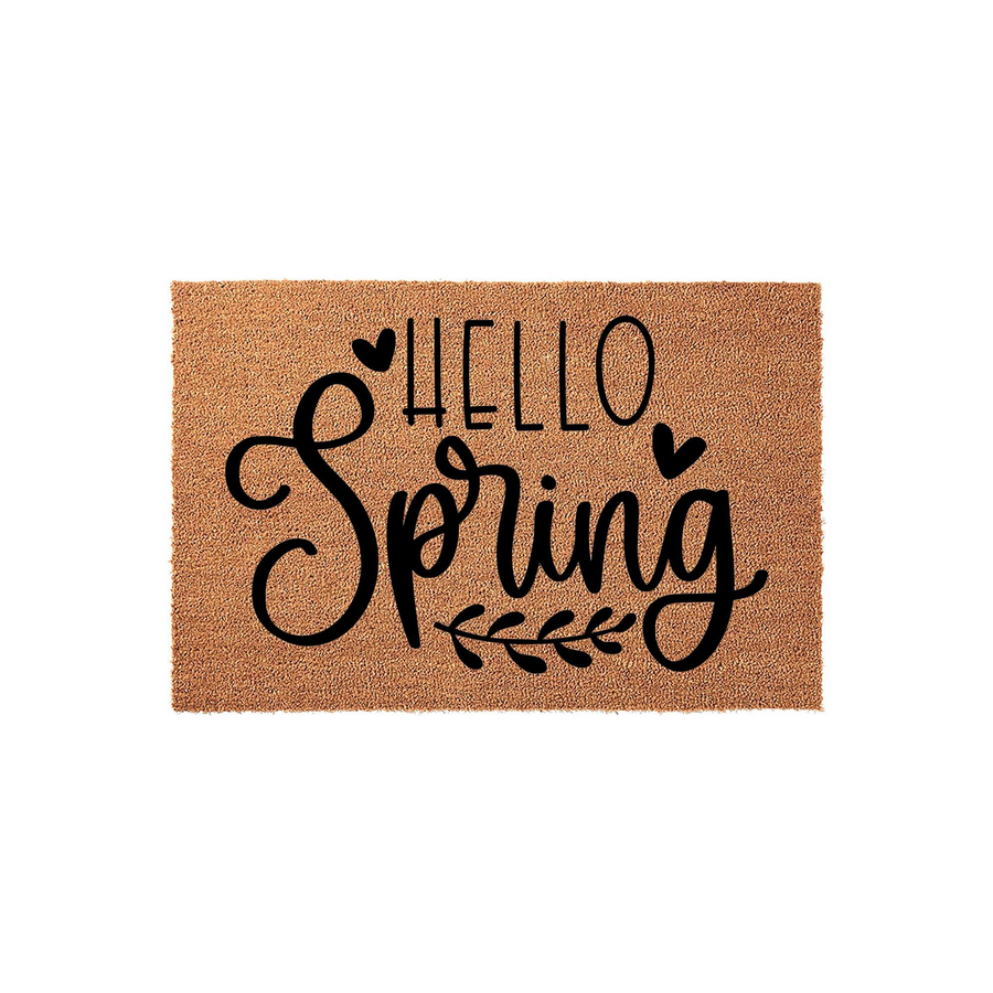Hello Spring coir doormat featuring a natural tan fiber texture with black printed text and decorative heart and leaf accents, creating a welcoming seasonal entryway decor piece for your front porch or home entrance.