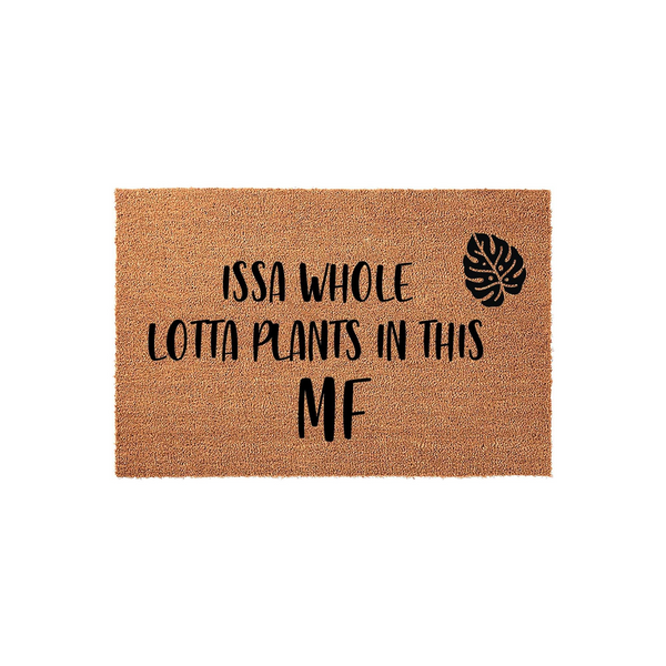 Plant Lover Coir Doormat featuring the humorous text Issa Whole Lotta Plants In This MF with a black monstera leaf graphic, set against a plain white background to highlight the natural brown texture of the durable outdoor