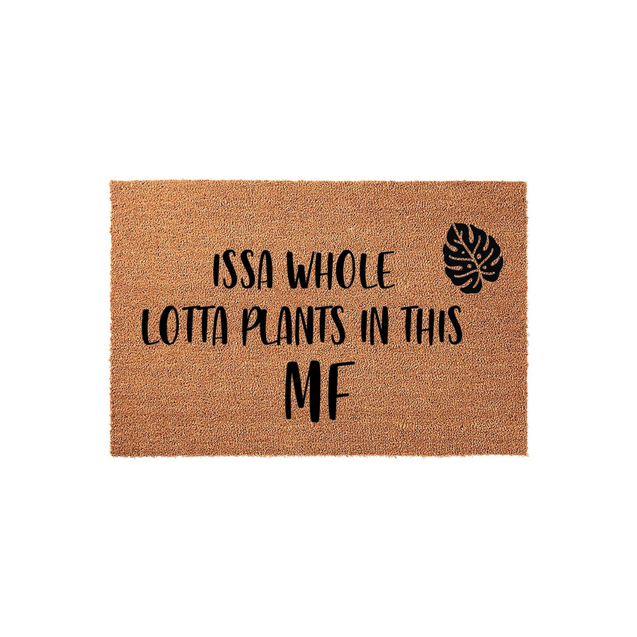 Plant Lover Coir Doormat featuring the humorous text Issa Whole Lotta Plants In This MF with a black monstera leaf graphic, set against a plain white background to highlight the natural brown texture of the durable outdoor
