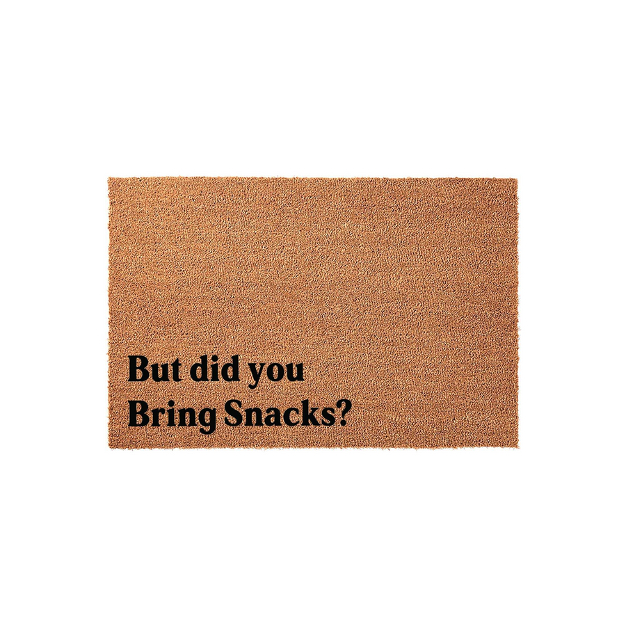 But Did You Bring Snacks Doormat made of natural coir fiber with a sturdy backing, featuring bold black text printed on the front that adds a humorous and welcoming touch to any front porch or entryway decor for guests and