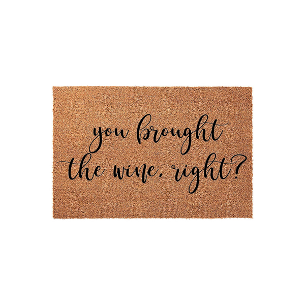 Funny You Brought The Wine Right Doormat featuring a natural coir fiber texture and bold black script lettering, making this humorous welcome mat a playful addition to any front porch or entryway for guests arriving at your home.