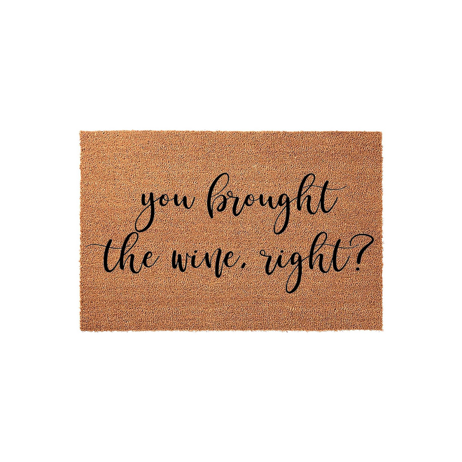 Funny You Brought The Wine Right Doormat featuring a natural coir fiber texture and bold black script lettering, making this humorous welcome mat a playful addition to any front porch or entryway for guests arriving at your home.