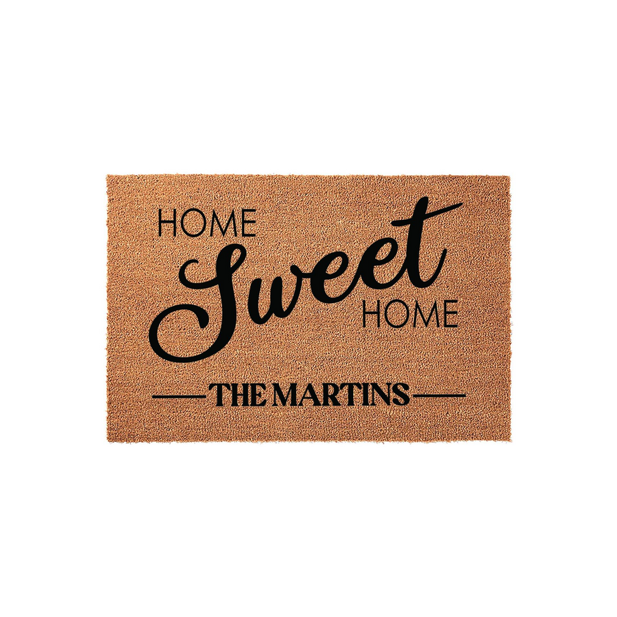 Personalized Home Sweet Home coir doormat featuring a natural brown fiber texture and bold black lettering that includes a custom family name, making it a welcoming addition to any front porch or entryway decor for new homeowners.