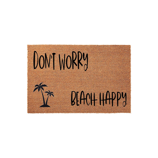 Don't Worry Beach Happy coir doormat featuring a natural brown fiber texture and black printed text with a tropical palm tree graphic, creating a fun coastal aesthetic for a front porch or entryway decor in a clean studio shot.