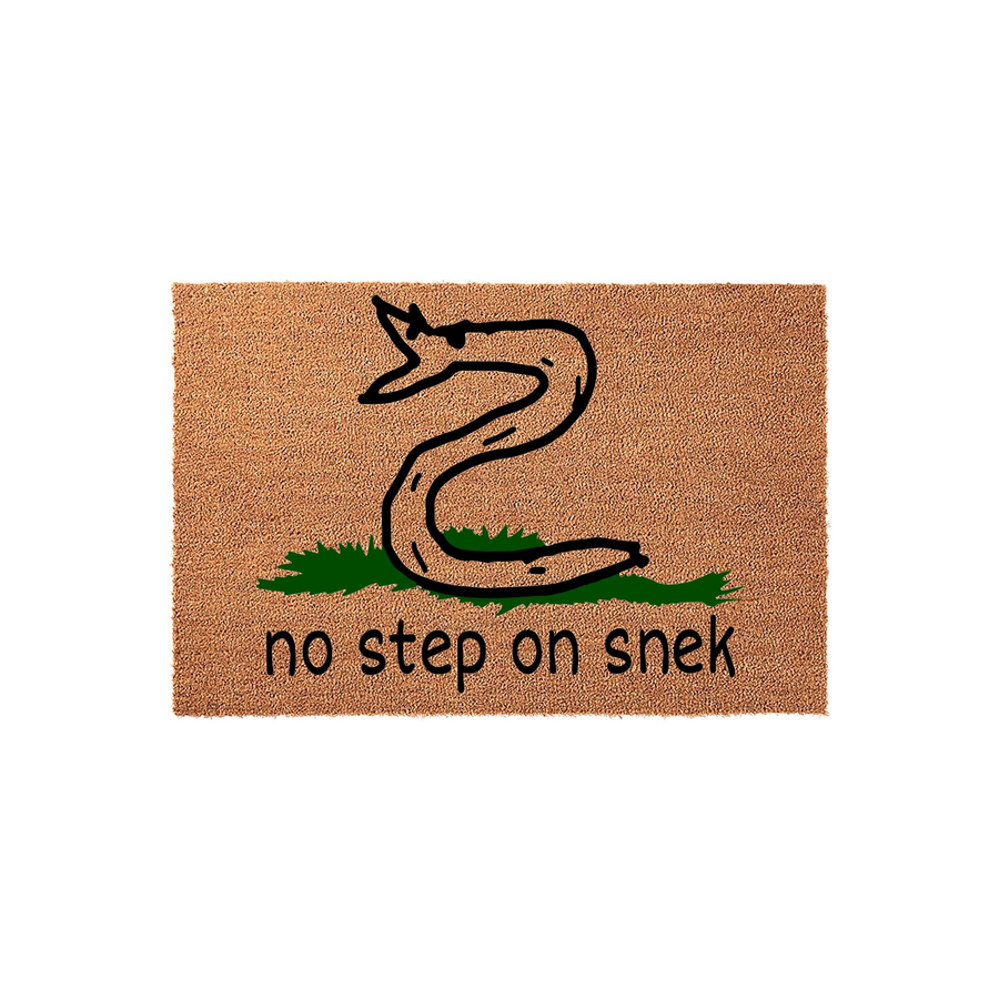 No Step On Snek funny doormat featuring a hand-drawn cartoon snake on a patch of green grass, printed on a natural coir fiber welcome mat with a humorous meme-inspired design that adds a playful touch to any front porch entryway.