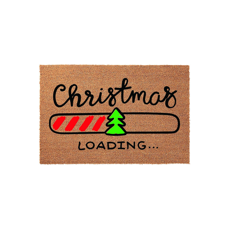 Christmas Loading coir doormat featuring a festive progress bar design with a small green pine tree icon, set against a natural tan fiber background to welcome guests to your home during the holiday season with a fun, modern