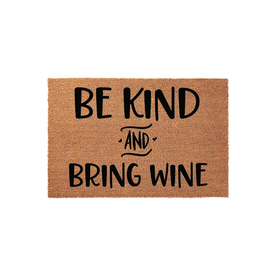 Be Kind and Bring Wine funny doormat featuring bold black typography printed on a natural tan coir fiber mat, creating a humorous and welcoming entrance decor piece for your front porch or home entryway that guests will surely