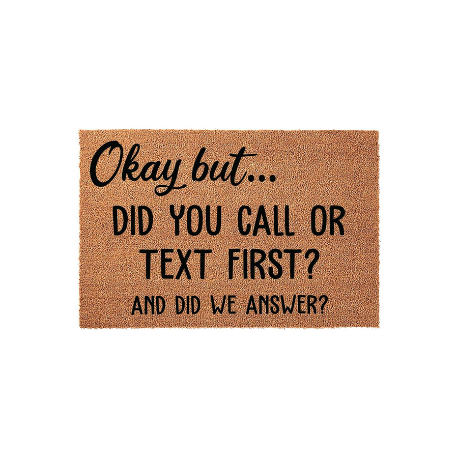 Funny Okay But Did You Call Or Text First Doormat featuring bold black text printed on a natural brown coir fiber mat, creating a humorous and welcoming entryway decor piece for your front porch that asks guests if they checked