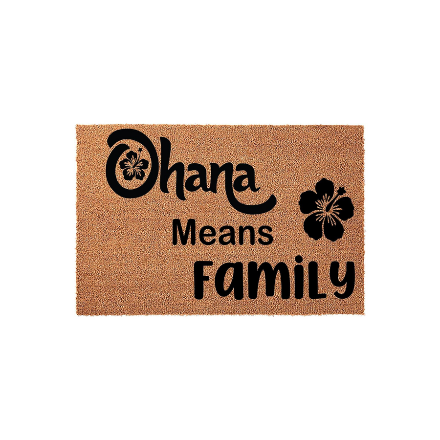 Ohana Means Family coir doormat featuring a natural tan fiber texture and bold black lettering with a tropical hibiscus flower accent, creating a welcoming entryway decor piece for any home that celebrates family and togetherness.