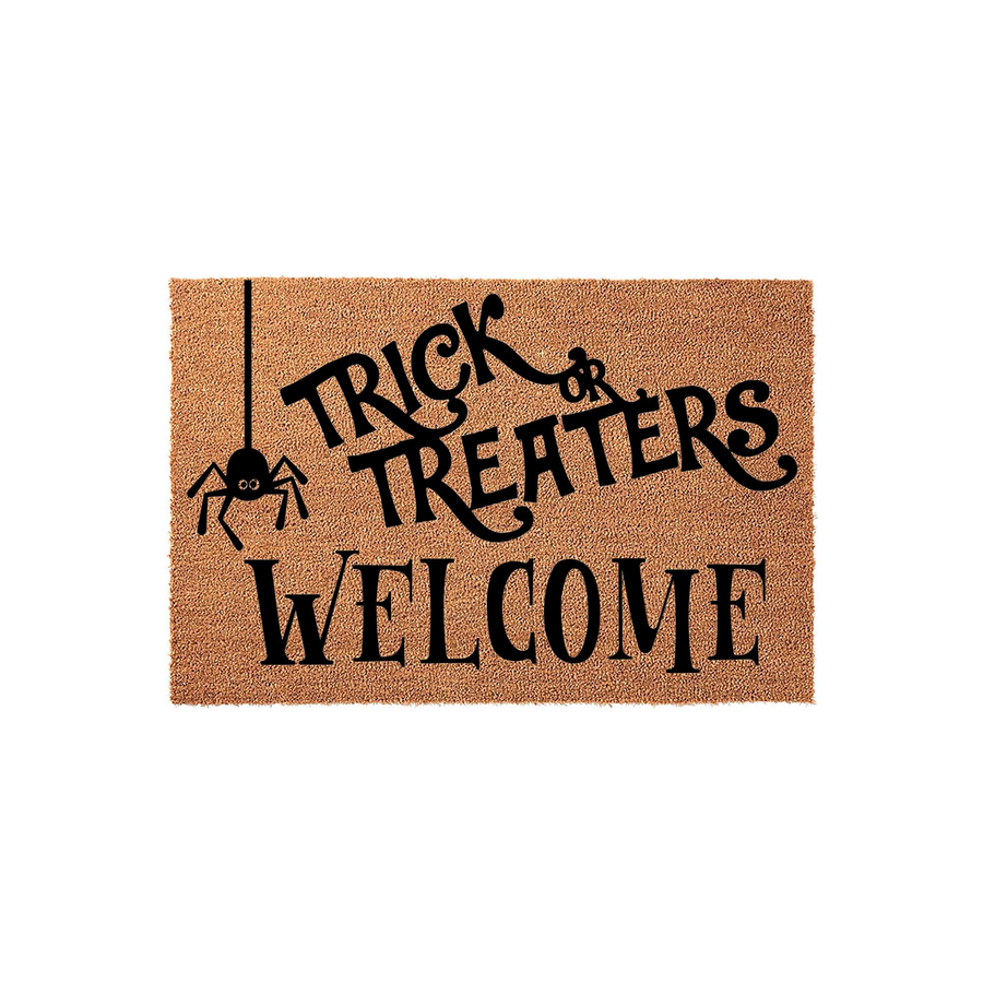 Trick or Treaters Welcome Halloween Doormat featuring a natural coir texture with black text and a hanging spider graphic, creating a festive seasonal entryway decoration for your front porch during the spooky autumn holiday