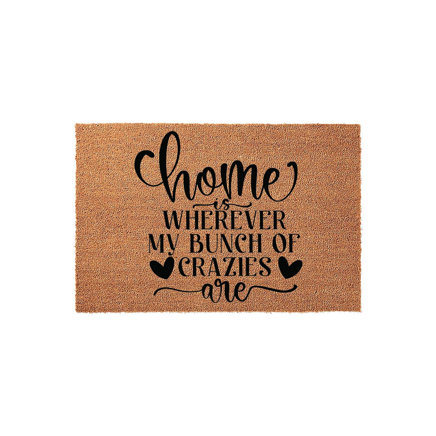 Home Is Wherever My Bunch Of Crazies Are coir doormat featuring natural brown fibers and bold black text with heart accents, providing a humorous and welcoming touch to any front porch entryway or home decor style for families.