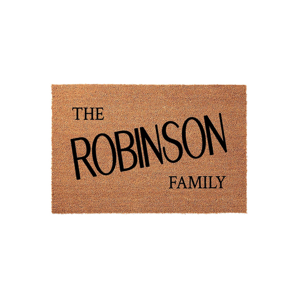 Personalized family name coir doormat featuring a natural tan fiber texture and bold black lettering that displays the phrase The Robinson Family, making it a classic and durable welcome mat for any front porch or entryway home