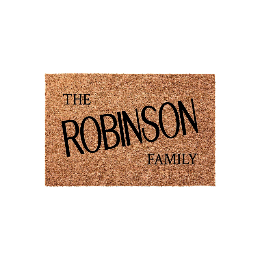 Personalized family name coir doormat featuring a natural tan fiber texture and bold black lettering that displays the phrase The Robinson Family, making it a classic and durable welcome mat for any front porch or entryway home