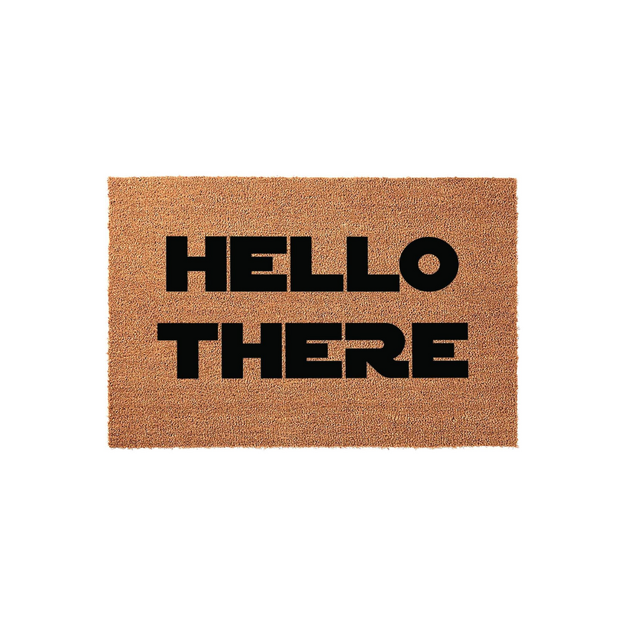 Hello There coir doormat featuring a natural brown coconut fiber texture and bold black block lettering, providing a welcoming and modern aesthetic for your front porch entryway or home doorstep to greet all your guests in style.