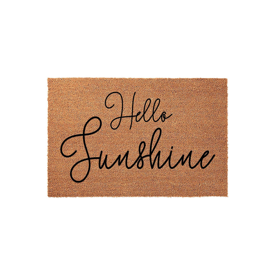 Hello Sunshine coir doormat featuring a natural brown fiber texture and elegant black cursive script lettering, providing a cheerful and welcoming entrance decor piece for your front porch or home entryway on a clean white