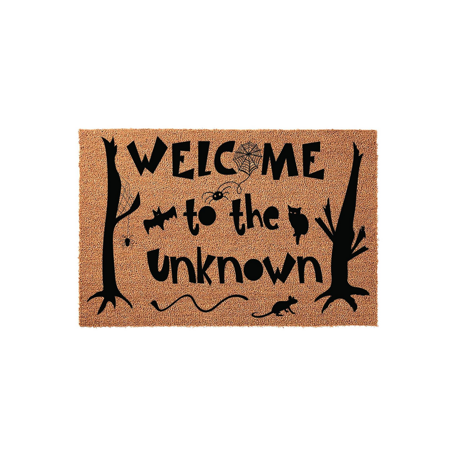Halloween Welcome to the Unknown coir doormat featuring a spooky black design with silhouetted trees, a spider web, bats, and a cat on a natural brown fiber background, perfect for adding a festive touch to your front porch decor.