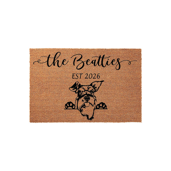 Personalized Schnauzer dog doormat featuring a cute illustration of a Schnauzer peeking over the bottom edge with its paws, printed on a natural coir fiber mat with custom family name text and an established year for a welcoming