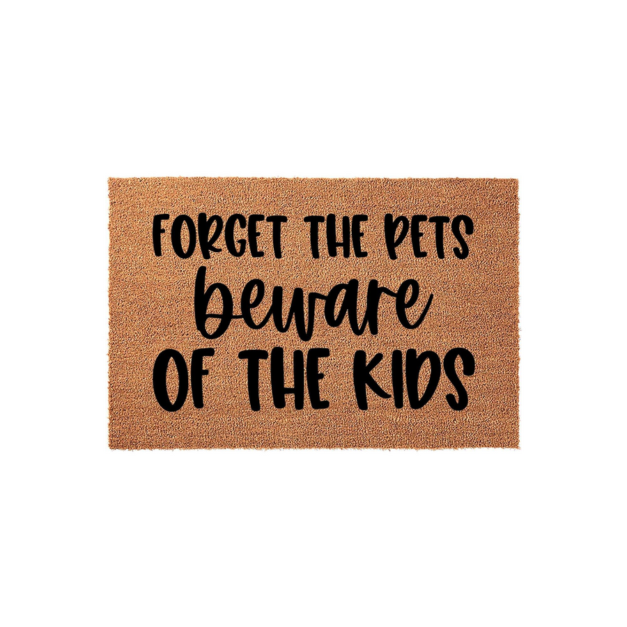 Funny Forget the Pets Beware of the Kids doormat featuring bold black text printed on a natural tan coir fiber mat, creating a humorous entryway welcome sign for families with children and pets on a clean white background.