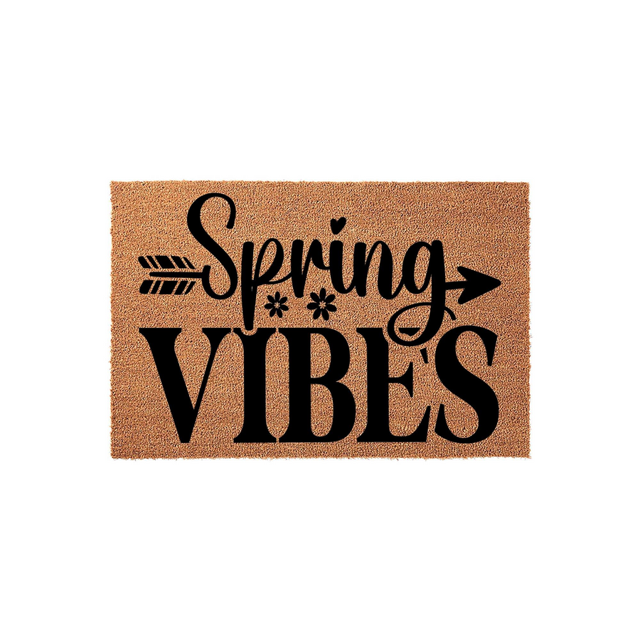 Spring Vibes coir doormat featuring a natural tan fiber texture with black text and a decorative arrow design, creating a cheerful seasonal welcome for your front porch entrance during the warmer spring months of the year.