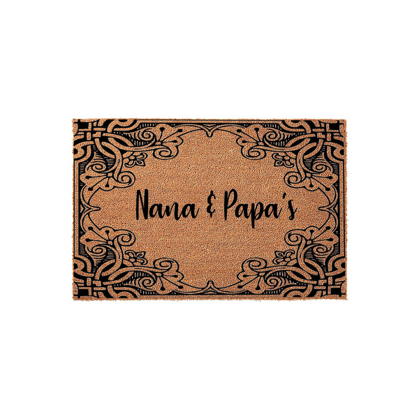 Nana and Papa's personalized coir doormat featuring a decorative black filigree border design on a natural tan fiber background, creating a welcoming entrance piece for a grandparent's home on a clean white studio backdrop.