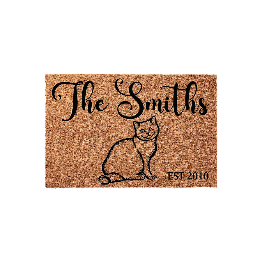 Personalized cat family doormat featuring a natural coir texture with a black illustration of a sitting cat, custom family name text, and an established year date, making it a charming addition to any pet lover's front porch