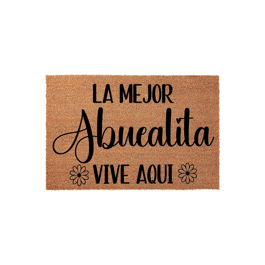 Personalized Abuelita coir doormat featuring the Spanish phrase La Mejor Abuelita Vive Aqui in elegant black lettering, set against a natural brown fiber background with two simple flower icons on either side of the bottom text