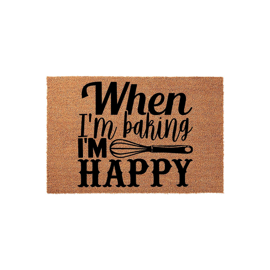 When I'm Baking I'm Happy coir doormat featuring a natural brown fiber texture and bold black lettering with a whisk graphic, making it a fun kitchen decor accent for any home baker who loves spending time in the kitchen.