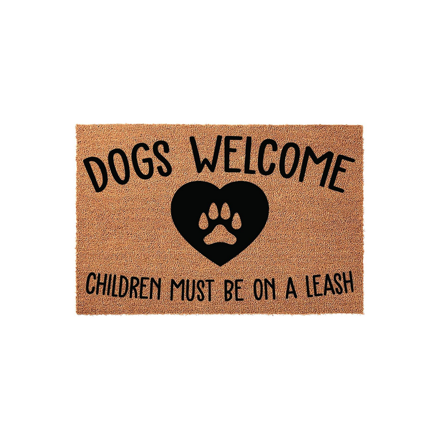 Dogs Welcome Children Must Be On A Leash coir doormat featuring a black heart with a paw print in the center, set against a natural tan textured background to create a humorous and welcoming entryway decor piece for any