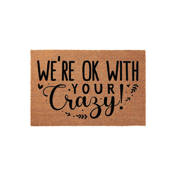 Funny Welcome Doormat featuring the text We are ok with your crazy in bold black lettering on a natural tan coir fiber background, creating a humorous and inviting entryway decor piece for your front porch or home entrance.