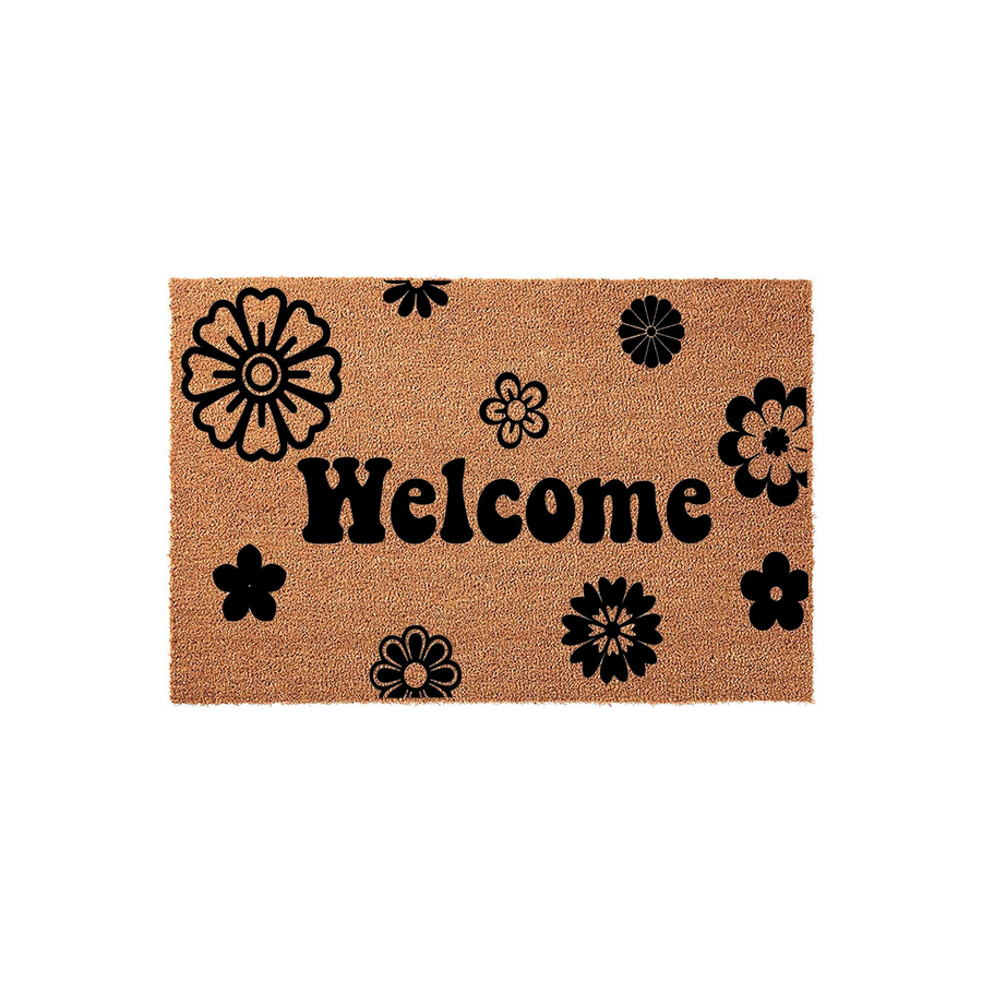 Floral Welcome Doormat featuring a natural coir fiber texture with a bold black printed design of various stylized flowers and the word Welcome centered in a playful, rounded font for a cheerful front porch entryway decor