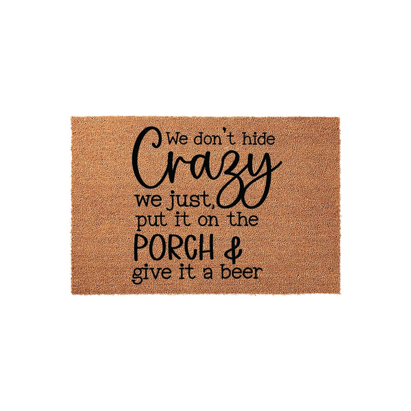 Funny We Don't Hide Crazy Porch Doormat made of natural coir fiber with black text that reads We don't hide crazy we just put it on the porch and give it a beer, displayed against a clean white background for a humorous home