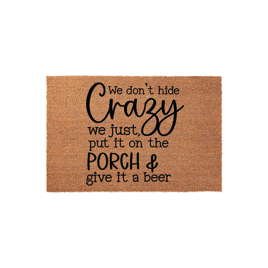 Funny We Don't Hide Crazy Porch Doormat made of natural coir fiber with black text that reads We don't hide crazy we just put it on the porch and give it a beer, displayed against a clean white background for a humorous home